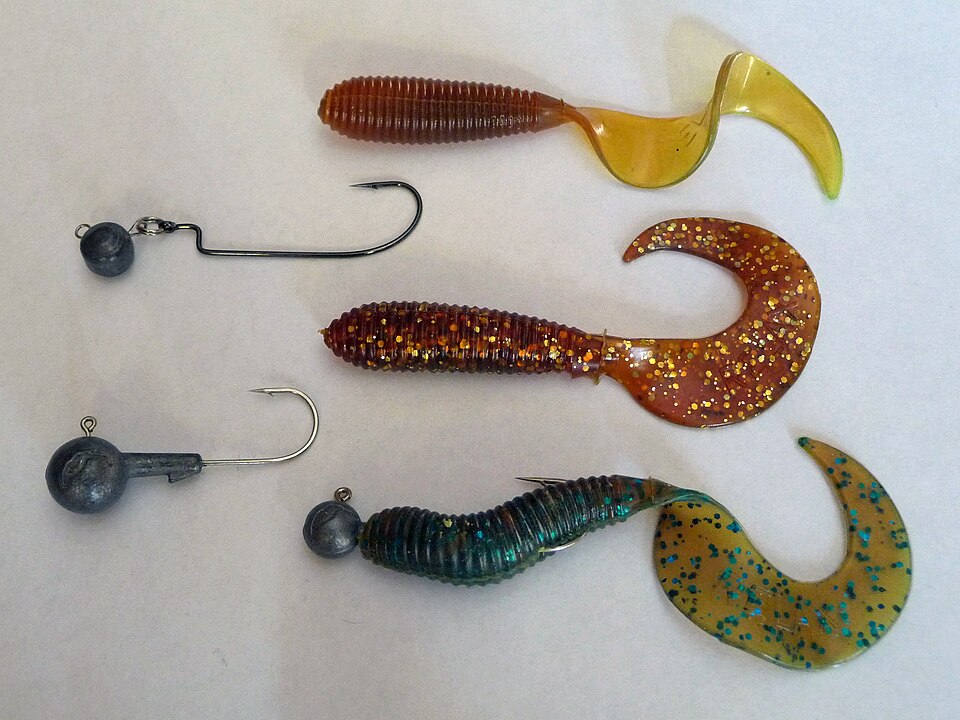 Jig heads with soft plastic twister-tail grubs