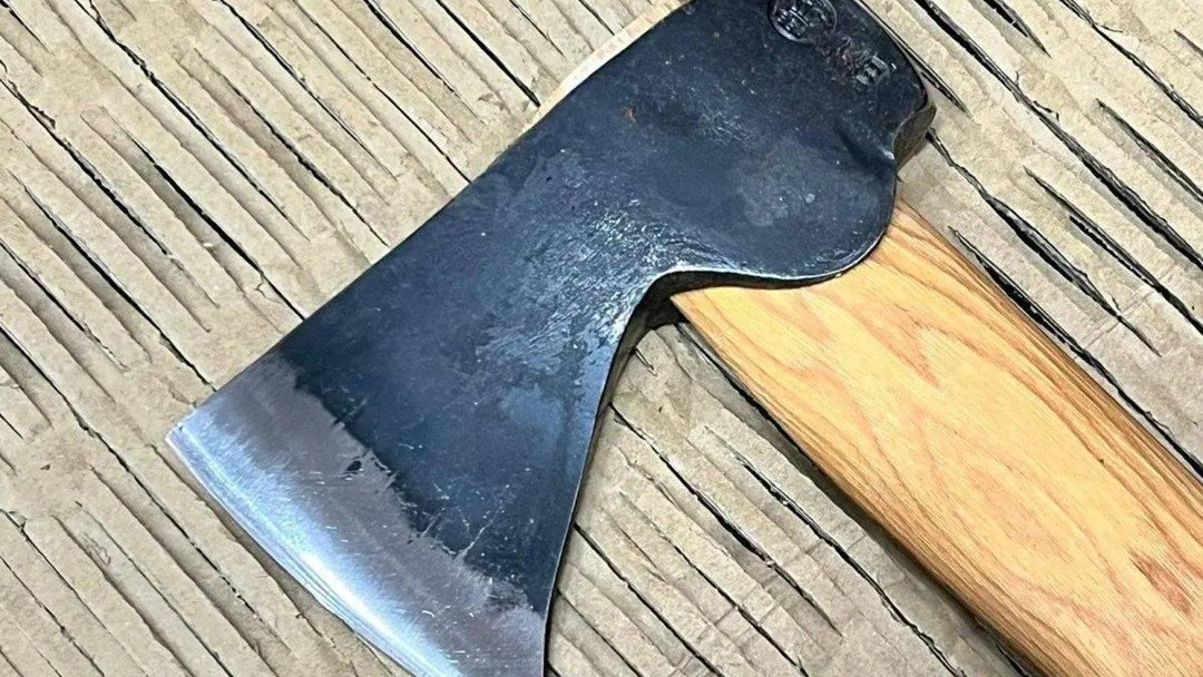 Gränsfors Bruk Hunters Axe 418 resting on wooden boards; product gallery photograph