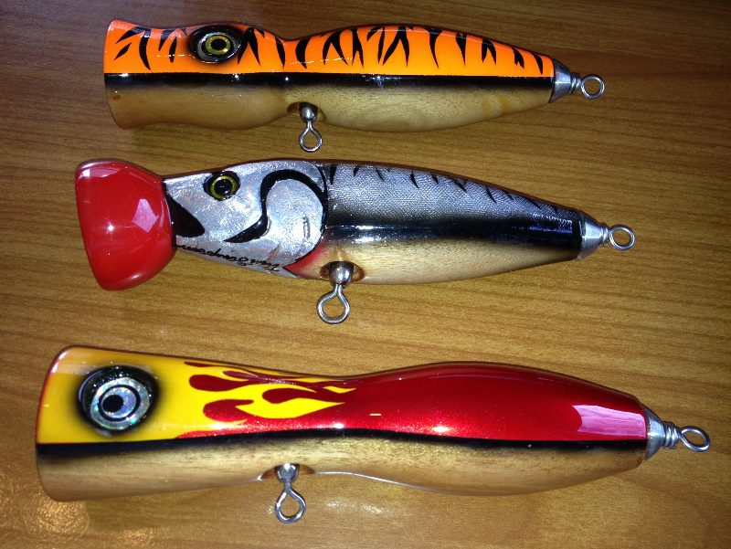 Topwater popper lures lined up