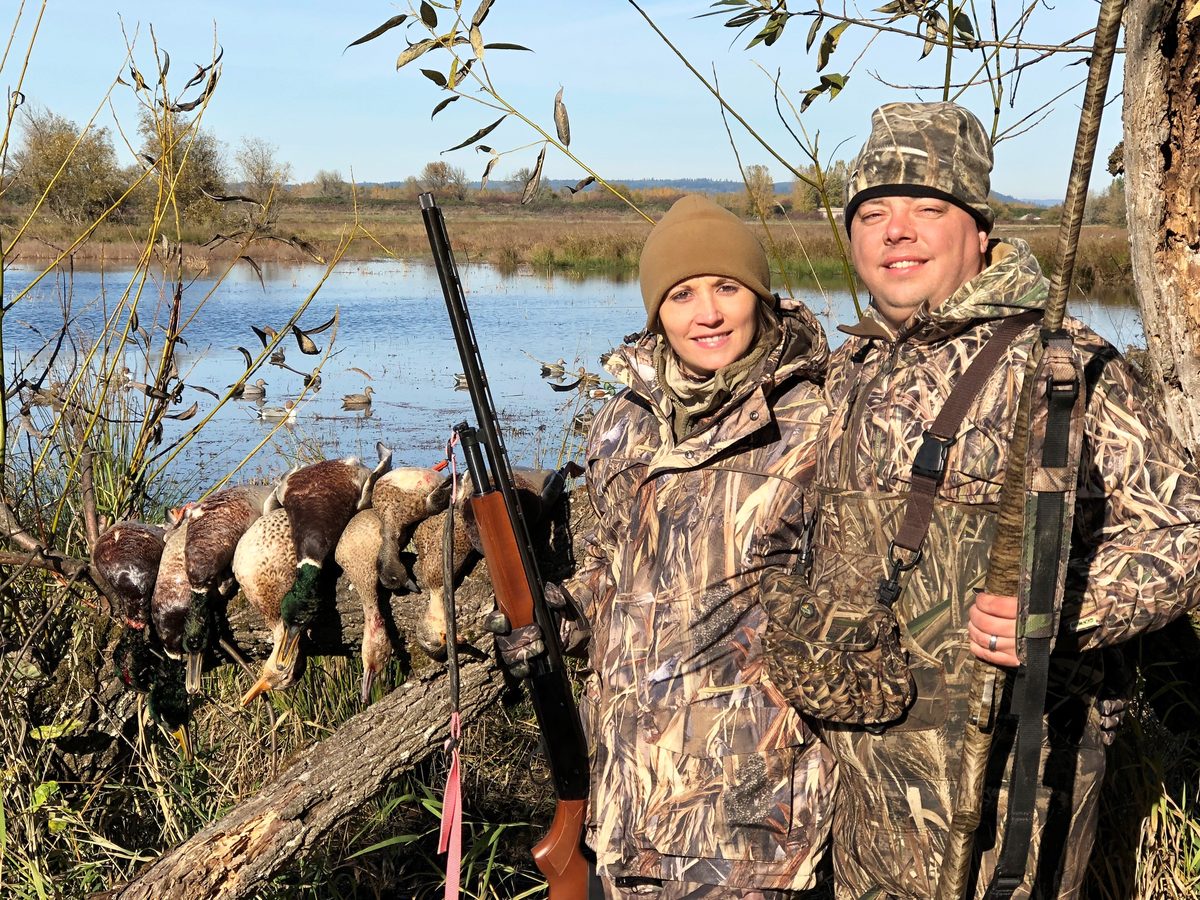 Waterfowl hunters set up over a marsh spread